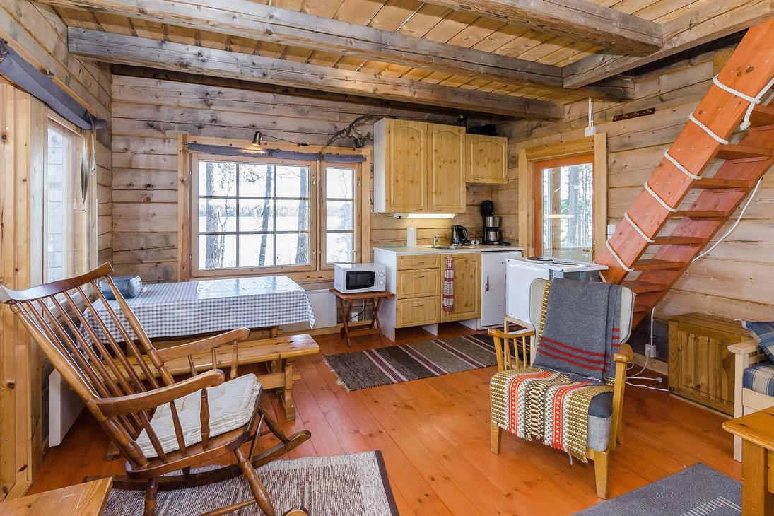 Hirsimökin tupakeittiö, jossa pirtinpöytä ja kiikkutuoli